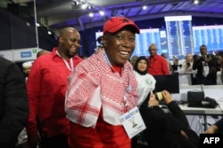 Economic Freedom Fighters (EFF) leader Julius Malema, right, reacts as he arrives for a press conference at the Independent Electoral Commission National Results Center at Gallagher Convention Centre in Midrand, South Africa, June 1, 2024.