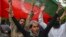 Pakistan Tehreek-e-Insaf (PTI) party activists and supporters of Pakistan's former Prime Minister Imran Khan celebrate after Supreme Court declared Khan's arrest "invalid", in Lahore, Pakistan, May 11, 2023.