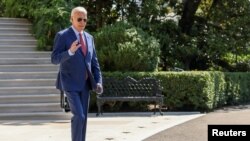 FILE - President Joe Biden walks toward the South Lawn of the White House as he departs on travel to Wilmington, Delaware, in Washington, Aug. 2, 2024. 