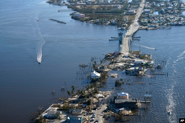 The bridge leading from Fort Myers to Pine Island, Fla., is heavily damaged in the aftermath of Hurricane Ian, Oct. 1, 2022. (AP Photo/Gerald Herbert, File)