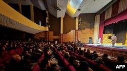 Actors perform a scene in a play during the 12th edition of the National Theatre Festival in Tripoli on December 20, 2023.