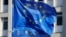 FILE - European Union flags fly outside the European Commission headquarters in Brussels, Belgium, March 1, 2023.
