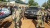 (FILE) Russian officers from the Wagner Group are seen around Central African president Faustin-Archange Touadera.