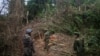 FILE - Armed rebels belonging to the Kachin Independence Army (KIA) ethnic group inspect the frontline, Oct. 13, 2016 near Laiza in Kachin State. The KIA said it took control of Panwa, a mining hub that is a major supplier of rare earth oxides to China, on Oct. 19, 2024.