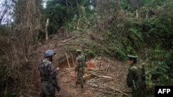 FILE - Armed rebels belonging to the Kachin Independence Army (KIA) ethnic group inspect the frontline, Oct. 13, 2016 near Laiza in Kachin State. The KIA said it took control of Panwa, a mining hub that is a major supplier of rare earth oxides to China, on Oct. 19, 2024.