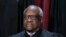 FILE - Associate Justice Clarence Thomas at the Supreme Court building in Washington, Oct. 7, 2022. An investigation by Democratic senators of the court's ethics details Thomas' luxury travel and urges Congress to establish a way to enforce a new code of conduct. 