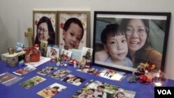 Vincent Khor Wei Fong has a tribute in his home to his wife, Chin Su King, and five-year-old son Daniel Khor Yen Hong who were both killed by the landslide in December. Photo taken Oct. 19. (Dave Grunebaum/VOA)