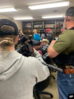 FILE - Residents crowd into a commissioners meeting, April 17, 2023, in Idabel, Oklahoma. A number of McCurtain County residents were outraged by comments from local officials.