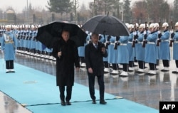 Turkish President Recep Tayyip Erdogan, left, welcomes Finnish President Sauli Niinisto at the presidential complex in Ankara on March 17, 2023.