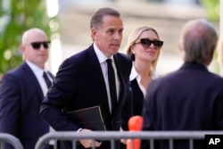 FILE - Hunter Biden arrives to federal court with his wife, Melissa Cohen Biden, June 10, 2024, in Wilmington, Del.