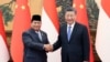 Presiden China Xi Jinping (kanan) berjabat tangan dengan Presiden terpilih Indonesia Prabowo Subianto di Balai Besar Rakyat China di Beijing, Senin, 1 April 2024. (Yao Dawei/Xinhua via AP)