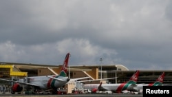 FILE - Kenya Airways planes are parked at the Jomo Kenyatta International Airport in Nairobi, Kenya, Nov. 5, 2022.