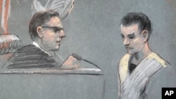 Massachusetts Air National Guardsman Jack Teixeira, right, appears in U.S. District Court in Boston, Friday, April 14, 2023. (Margaret Small via AP)