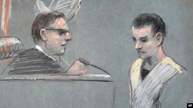 Massachusetts Air National Guardsman Jack Teixeira, right, appears in U.S. District Court in Boston, Friday, April 14, 2023. (Margaret Small via AP)