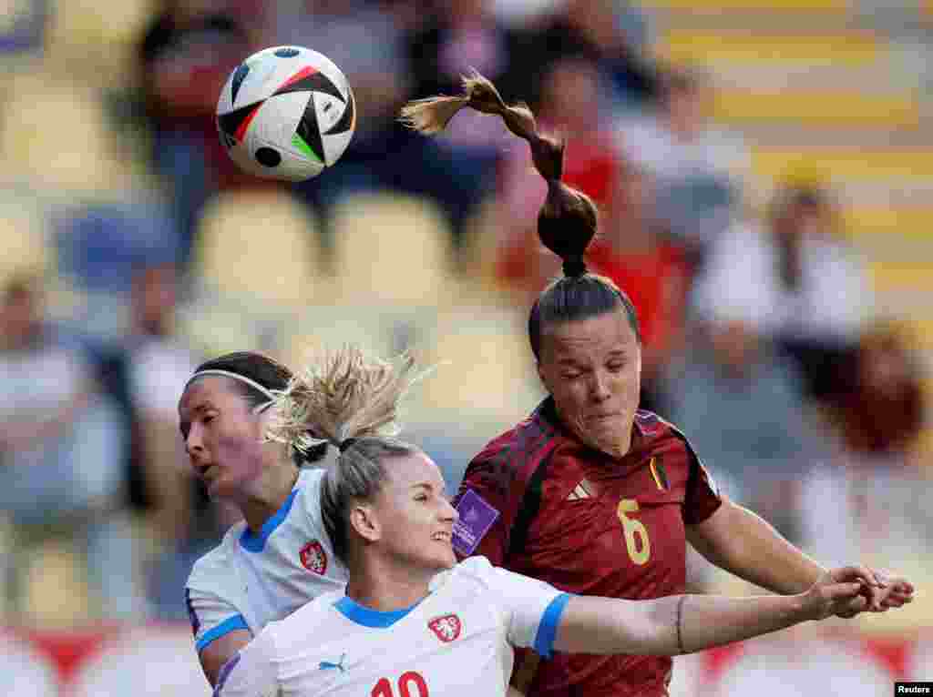 Czech Republic's Aneta Dedinova fights for the ball with Belgium's Tine De Caigny during the women's Euro 2025 qualifying football match between Belgium and Czech Republic at the Diao Wasabi Stayen Stadium in Sint-Truiden, Belgium, June 4, 2024.