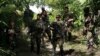 (FILE) Army troops stand guard in a Colombian village in 2006.