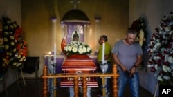 Mourners attended the wake of mayoral candidate Armando Perez in Maravatio, Michoacan state, Mexico, Feb. 27, 2024.