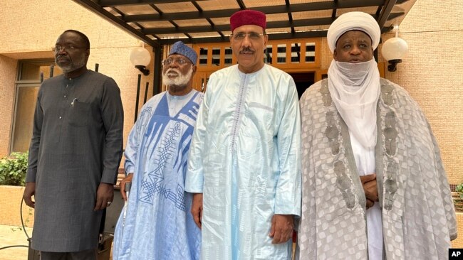 From left; ECOWAS Commission President Mousa Tourey, ECOWAS Special Envoy to Republic of Niger General Abdulsalami Abubakar, ousted Niger President Mohamed Bazoum, and Sultan of Sokoto Alhaji Muhammad Saad Abubakar III, in Niamey, Niger, Aug. 19, 2023.