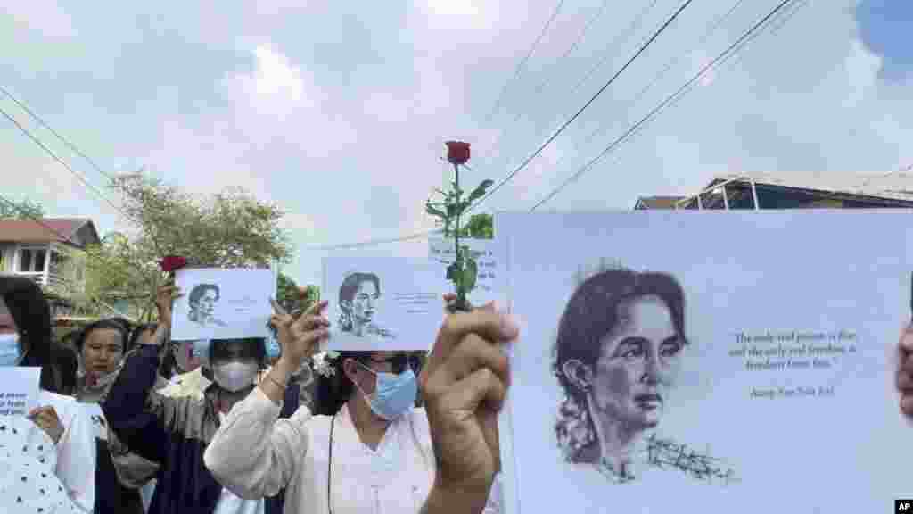 Demonstrators hold papers printed with Aung San Suu Kyi&rsquo;s famous quote as they rally to mark her 79th birthday in Launglon township in Tanintharyi region, Myanmar.
