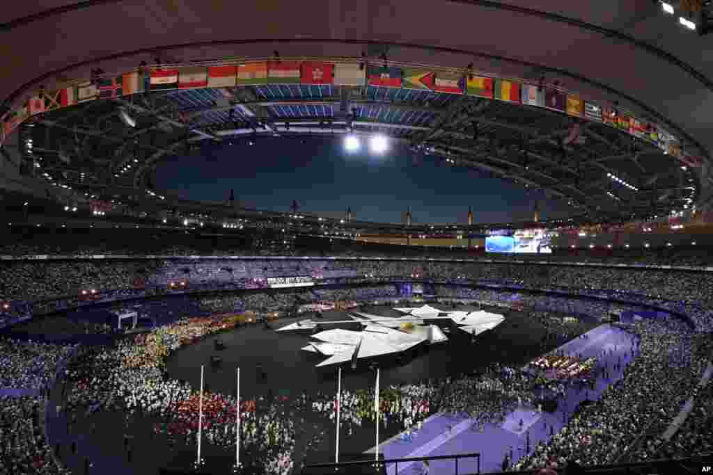 Athletes gather during the 2024 Summer Olympics closing ceremony at the Stade de France, Aug. 11, 2024, in Saint-Denis, France. 