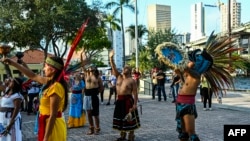 FILE - Indigenous peoples of the Americas protest against the anti-immigration law signed by Florida Gov. Ron DeSantis, in Miami, June 4, 2023. The law, which took effect July 1, in part requires hospitals that accept federal health insurance to collect patient immigration data.