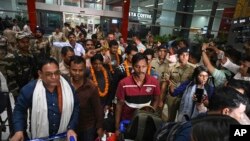 Indians evacuated from Sudan arrive on a flight at the Indira Gandhi International Airport in New Delhi, India, April 26, 2023.