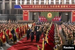 North Korean leader Kim Jong Un, his wife Ri Sol Ju and their daughter Kim Ju Ae attend a military parade to mark the 75th founding anniversary of North Korea's army, at Kim Il Sung Square in Pyongyang, North Korea February 8, 2023, in this photo released by North Korea's Korean Central News Agency (KCNA).