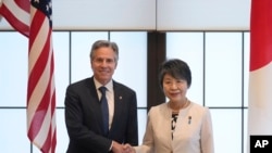 US Secretary of State Antony Blinken, left, and Japanese Foreign Minister Yoko Kamikawa shake hands before their bilateral meeting at the Foreign Ministry's Iikura guesthouse in Tokyo, July 28, 2024.