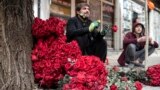 Afghan vendors selling roses wait for customers along the flower street on the occasion of Valentine's Day in the Shar-e-Naw area of Kabul, Feb. 14, 2023. 