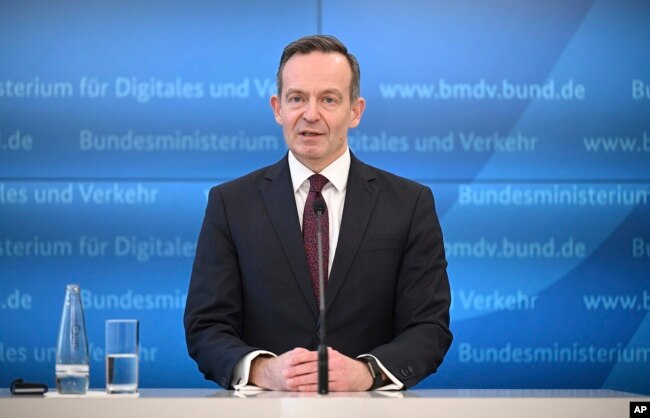 Volker Wissing, Federal Minister of Digital Affairs and Transport speaks on the use of e-fuels for new combustion engines even after 2035 and in the existing fleet in Berlin, Germany, Tuesday, Feb. 28, 2023. (Britta Pedersen/dpa via AP)