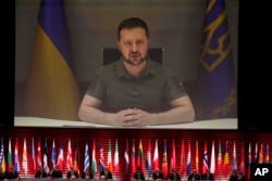 Ukraine's President Volodymyr Zelenskyy addresses, via videolink, the opening ceremony of the Council of Europe summit in Reykjavik, Iceland, May 16, 2023.