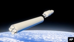 FILE - In this video grab provided by RU-RTR Russian television via AP on March 1, 2018, a computer simulation shows the a hypersonic vehicle being released from booster rockets high above the Earth's orbit.