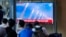 A TV screen shows a report of North Korea's multiple rocket launchers during a news program at the Seoul Railway Station in Seoul, South Korea, May 31, 2024. 