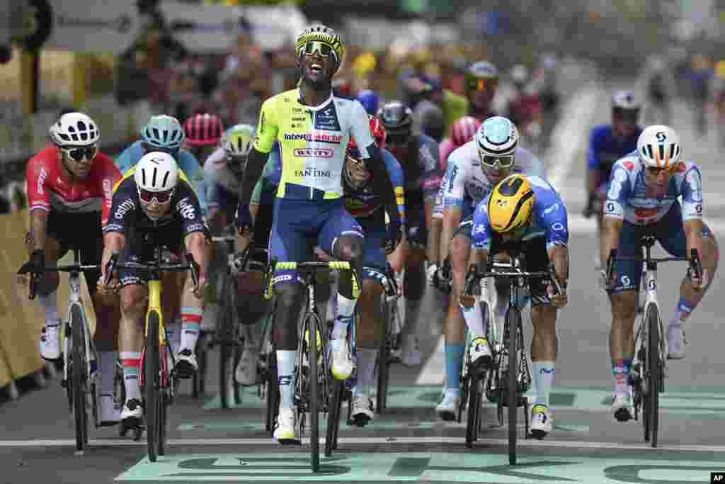 Eritrea&#39;s Biniam Girmay celebrates as he crosses the finish line during the third stage of the Tour de France cycling race over 230.8 kilometers (143.4 miles) with start in Piacenza and finish in Turin, Italy. (AP Photo/Daniel Cole)