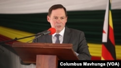 Nikolai Krasilnikov, Russian ambassador to Zimbabwe, speaks in Harare on March 20, 2024, after his country’s donation of grain and fertilizer to the southern African nation.
