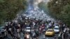 FILE - Protesters chant slogans during a demonstration over the death of a woman who was detained by the morality police, in Tehran, Iran, on Sept. 21, 2022.