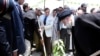 Iran's President Ebrahim Raisi, right, plants a mango tree with Pakistan's Prime Minister Shahbaz Sharif, center, during an inauguration of the Mand-Pishin border in Pishin, May 18, 2023. (Pakistan Prime Minister Office via AP)