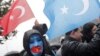 FILE - Ethnic Uyghur demonstrators wave flags of Turkey and East Turkestan during a protest against China, near the Chinese Consulate in Istanbul, Feb. 5, 2023.