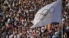 The Olympic flag flies during the Olympic flame handover ceremony, April 26, 2024, in Athens, at Panathenaic stadium, where the first modern games were held in 1896.