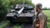 FILE - Ukrainian marines check their French-made AMX-10 RC armored fighting vehicle at a position in the Donetsk region on July 10, 2023.