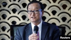 FILE - Cambodian opposition figure Sam Rainsy speaks during a press freedom event at the Gran Melia Hotel in Jakarta, Indonesia, May 19, 2023.