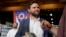 FILE - J.D. Vance, the venture capitalist and author of "Hillbilly Elegy," holds his book as he speaks with supporters after a rally, July 1, 2021, in Middletown, Ohio, where he announced he is joining the crowded Republican race for the Ohio U.S. Senate seat. 