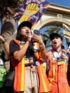 FILE - SAG-AFTRA leaders cheer for striking actors outside Paramount Pictures studio, in Los Angeles, Nov. 3, 2023. Hollywood's video game performers voted to go on strike July 25, 2024, throwing part of the entertainment industry into another work stoppage.