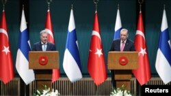 Finland's President Sauli Niinisto, left, and Turkey's President Tayyip Erdogan hold a joint news conference after their meeting in Ankara, Turkey, March 17, 2023. (Presidential Press Office/Handout via Reuters)