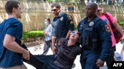 A pro-Palestinian protestor is arrested at the University of Texas in Austin, Texas, on April 29, 2024.