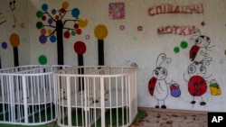 Empty playpens are seen in the courtyard of Kherson regional children's home, in Kherson, southern Ukraine, Nov. 25, 2022. Throughout the war in Ukraine, Russian authorities have been accused of deporting Ukrainian children to Russia or Russian-held territories.