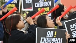 South Korean protesters hold a rally against South Korea's announcement of plans to compensate victims of Japan's forced wartime labor, outside the Foreign Ministry in Seoul on March 6, 2023.