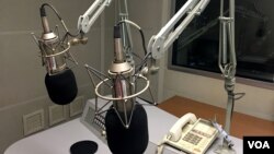 Microphones are seen here in a recording studio on May 2, 2023. A Swiss radio station recently carried out a social experiment on air, testing robot-created content and voicing. (VOA Photo)