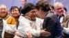 Canada’s Prime Minister Justin Trudeau, right, is greeted by an elder during a devolution ceremony at the Aqsarniit Hotel & Conference Centre in Iqaluit, Nunavut, Canada, Jan. 18, 2024.