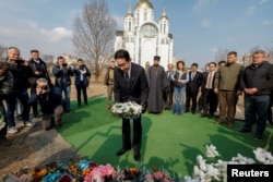 Japanese Prime Minister Fumio Kishida visits the site of a mass grave in the town of Bucha, amid Russia's attack on Ukraine, outside of Kyiv, Ukraine, March 21, 2023.